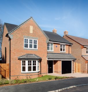 Photo of semi-detached residential home with intergral garage